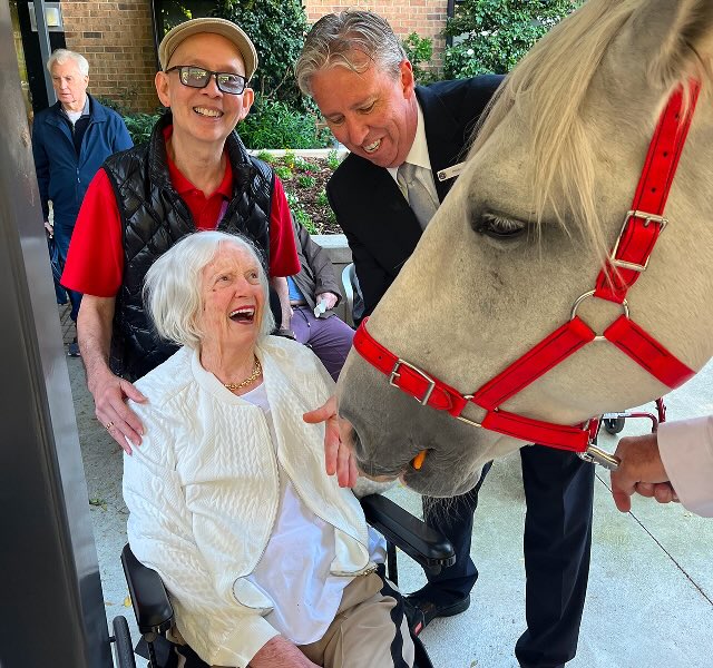 funeral director and woman with horse