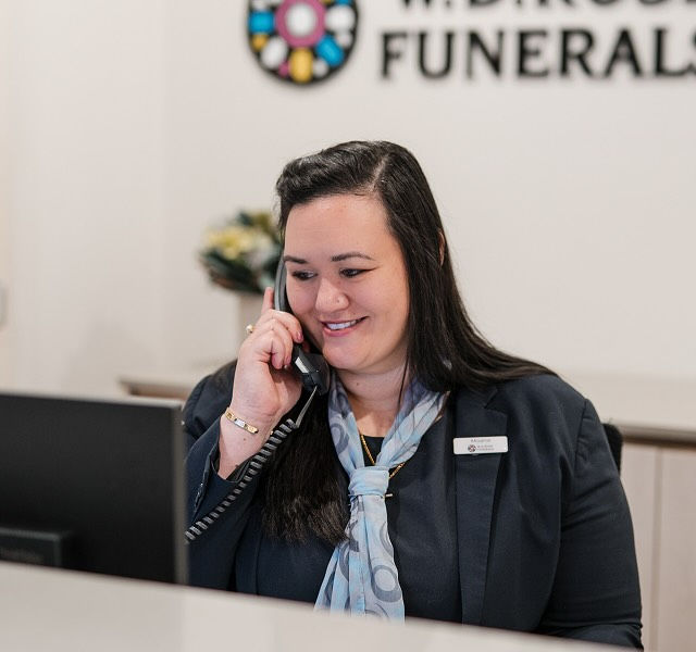 funeral director helping family